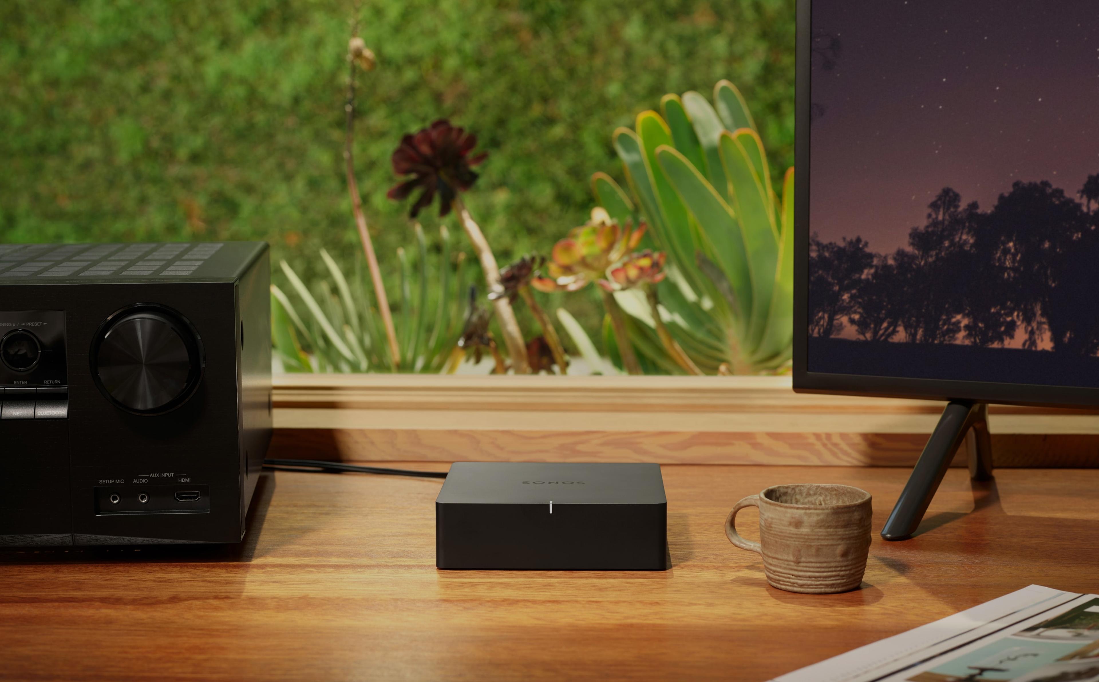 Sonos Port on desk next to stereo receiver
